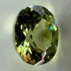 0.48 carat natural demantoid garnet from Namibia, light bright green color, beautiful clarity, and brilliance.