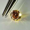 0.30 carat natural orange-yellow diamond with SI2 clarity and vibrant luster, perfect for jewelry or collection.