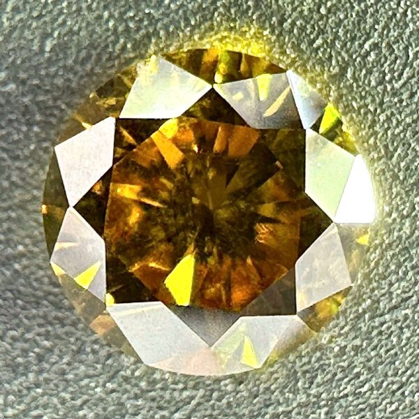 0.30 carat natural orange-yellow diamond with SI2 clarity and vibrant luster, perfect for jewelry or collection.