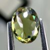 0.46 carat natural demantoid garnet from Namibia, bright green color, eye-clean clarity, and exceptional brilliance.