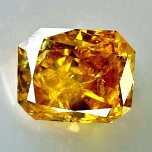 0.54ct Natural Orange-Yellow Diamond, Fancy Intense, Radiant Shape, with I2 Clarity, Perfect for Unique Jewelry Creations.
