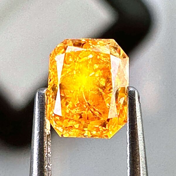 0.54ct Natural Orange-Yellow Diamond, Fancy Intense, Radiant Shape, with I2 Clarity, Perfect for Unique Jewelry Creations.