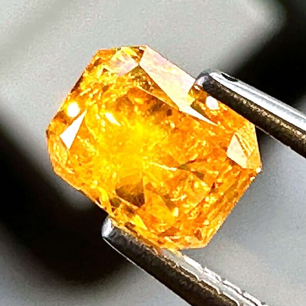 0.54ct Natural Orange-Yellow Diamond, Fancy Intense, Radiant Shape, with I2 Clarity, Perfect for Unique Jewelry Creations.