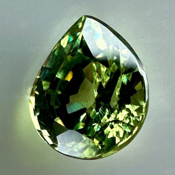 0.43 carat natural demantoid garnet from Namibia, bright green color, and excellent clarity.
