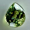 0.43 carat natural demantoid garnet from Namibia, bright green color, and excellent clarity.