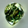 0.43 carat natural demantoid garnet from Namibia, bright green color, and excellent clarity.