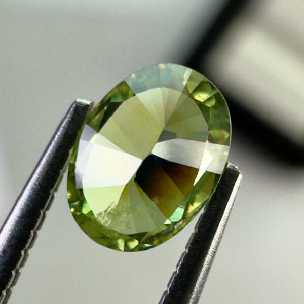 0.40 carat natural demantoid garnet from Namibia, very bright green color, oval cut, and untreated.
