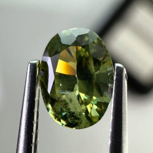0.40 carat natural demantoid garnet from Namibia, very bright green color, oval cut, and untreated.