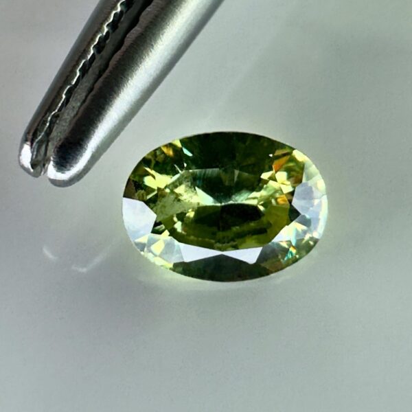 0.40 carat natural demantoid garnet from Namibia, very bright green color, oval cut, and untreated.