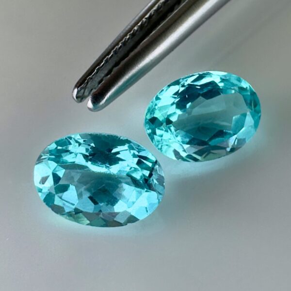 Pair of 1.99 carat blue Paraiba-type apatites, oval cut, vibrant turquoise blue and brilliant appearance.