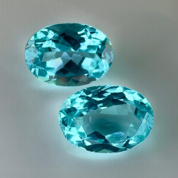 Pair of 1.99 carat blue Paraiba-type apatites, oval cut, vibrant turquoise blue and brilliant appearance.