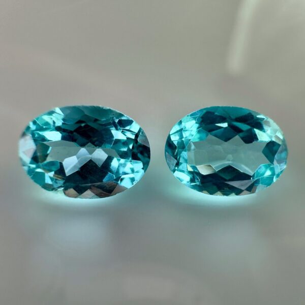 Pair of 1.99 carat blue Paraiba-type apatites, oval cut, vibrant turquoise blue and brilliant appearance.