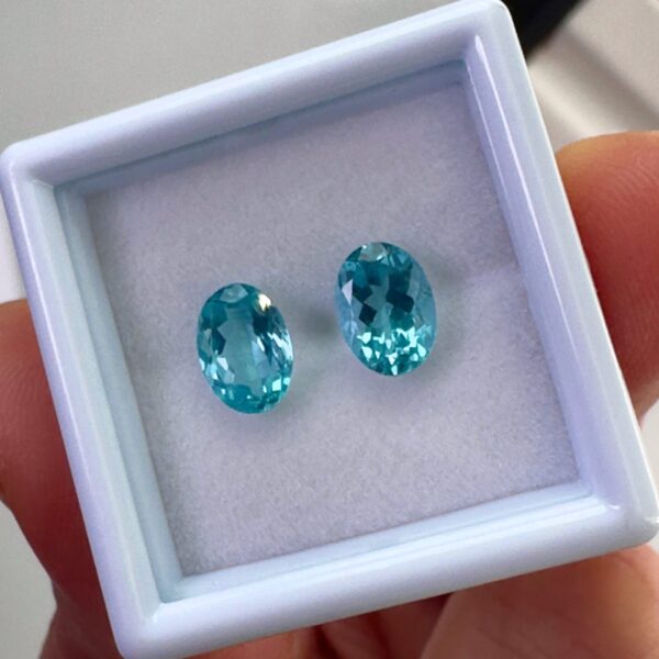 Pair of 1.99 carat blue Paraiba-type apatites, oval cut, vibrant turquoise blue and brilliant appearance.