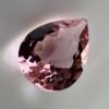 Pink tourmaline gemstone, 0.58 carat, pear-shaped cut, rare salmon pink color, beautiful clarity, and brilliant shine.