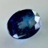 Natural blue sapphire 0.87 ct, oval cut, navy blue color, Thailand origin, jewelry quality gemstone with very few inclusions.